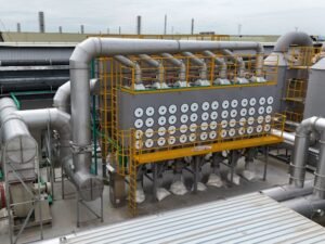 Industrial cartridge dust collector system installed on factory rooftop for air filtration