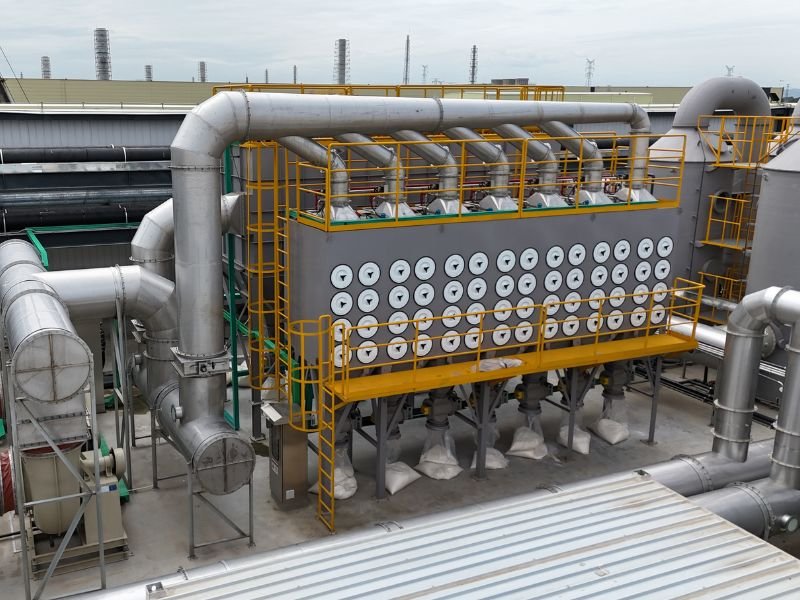 Industrial cartridge dust collector system installed on factory rooftop for air filtration